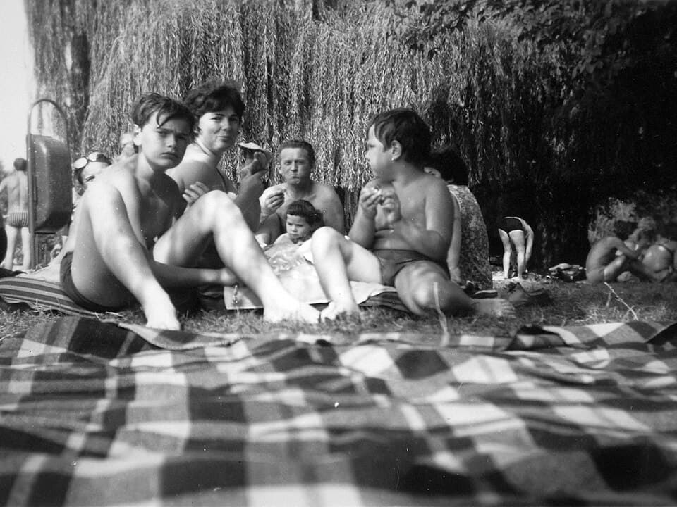 A family together on a beach, one of many moments organized into a Memora timeline